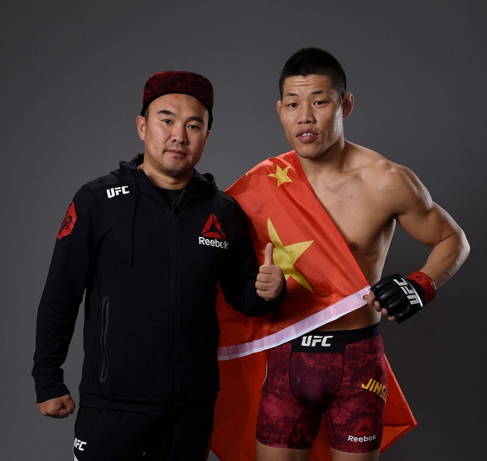 li-jingliang-of-china-poses-for-a-portrait-backstage-with-his-coach-picture-id878948682.jpg